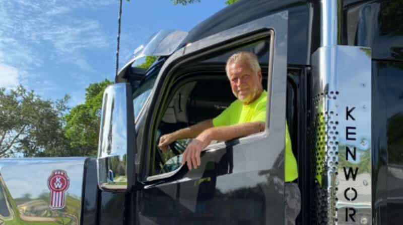 John Standing in the Door of His Truck