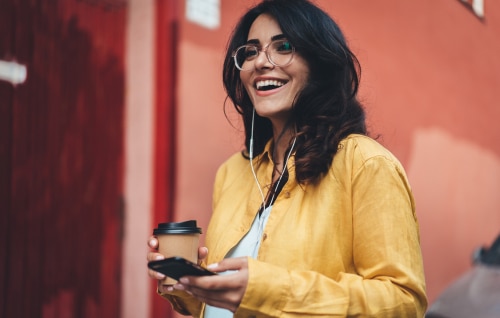 Woman with coffee and phone
