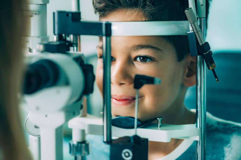 Boy having his eyes examined
