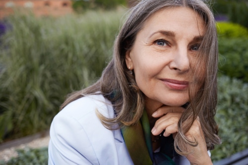 woman in blue shirt looking at camera