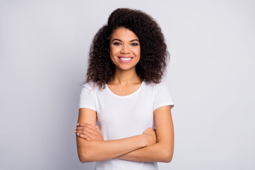 Happy woman with arms crossed