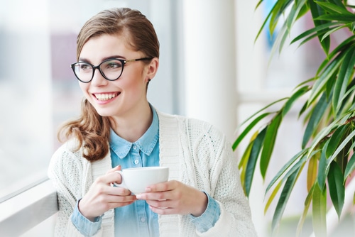 woman drinking cup of coffee 